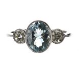 Platinum aquamarine and diamond rub-over set three stone ring, the oval aquamarine 1.50ct approx,