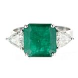 Modern 18ct white gold square emerald and trilliant cut diamond trilogy ring, the emerald 2.28ct