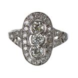 Art Deco style platinum diamond cluster ring, with three pricipal round-cut diamonds in an oval