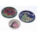 Moorcroft Pottery to include two small dishes in 'Hibiscus' and 'Magnolia' patterns; also a 'Des