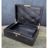 Early 20th century leather bound travelling stationery case, the hinged cover with recessed brass