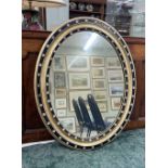 19th century Irish oval wall mirror, set with faux gem stones to the frame, 23" x 29"