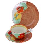 Clarice Cliff Bizarre 'Nasturtium' trio, comprising a tea cup, saucer and side plate, the side plate