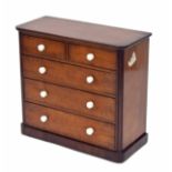 Miniature apprentice mahogany chest of two short over three long graduated drawers, with porcelain