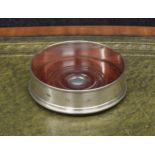 John Bull Ltd. silver wine coaster, with reeded borders on a turned wooden base with green baize