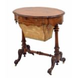 Victorian walnut oval work table, the moulded top over a single slim drawer and work basket,