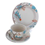 Clarice Cliff 'Mowcop' trio, comprising a tea cup, saucer and side plate, the side plate 6.5"