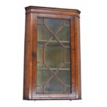 19th century mahogany hanging corner cabinet, moulded cornice over a astragal glazed door