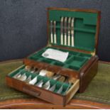 Walnut veneered cutlery canteen, containing some plated cutlery (incomplete), key