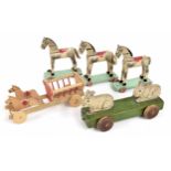 A selection of rolling treen animal toys, animated rabbits, horse & cart and three horses 8" high (