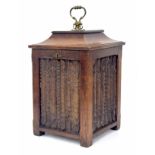 Antique oak fireside coal bucket, the hinged caddy top cover closing a metal liner over four