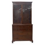 Georgian mahogany library bookcase, with a stepped cornice over astragal glazed doors enclosing a