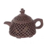 Chinese Yixing clay teapot, the outer reticulated body with fish decoration behind, makers stamp