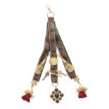 Attractive floral four strand embroidered ribbon chatelaine, with four gilded fobs, cabouchon garnet