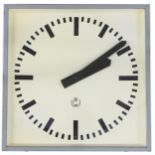 Electric 12" square wall dial bearing the makers logo TCW, within a light grey metal casing