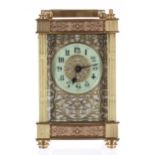 Carriage clock timepiece, the 1.75" cream chapter ring within a foliate pierced mask and ornate