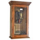 Gillett & Johnstone electric master wall clock, within an oak glazed case with stepped moulded