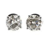 Certificated pair of 18ct white gold round brilliant-cut diamond solitaire stud earrings, diamonds