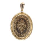 Attractive oval engraved high carat oval locket with a foliate design, 11.2gm, 53mm x 32mm