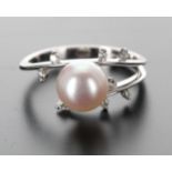 Modern 18ct white gold cultured pearl and diamond dress ring, the pearl 8mm, with eight small