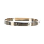 9ct yellow gold bangle in the style of Cartier, 20.4gm, 66mm wide