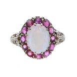 Ornate 9ct cabouchon opal and ruby oval cluster ring, 3.9gm, 15mm x 13mm, ring size M