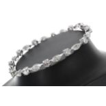Fine quality 18ct white gold diamond line bracelet, set with alternate round brilliant cut and