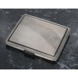 Art Deco silver cigarette case, with engine turned decoration and black enamelled border, the