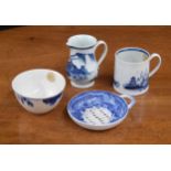 Four pieces of 18th century English porcelain to include a pearlware strainer, 3.75" diameter; tea