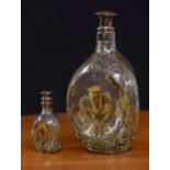 Haig's dimple whisky decanter with a silvered overlay foliate scrolling decoration around thistles