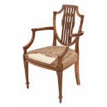 Hepplewhite style satinwood shield back carver armchair, with carved swag and rosette decoration,