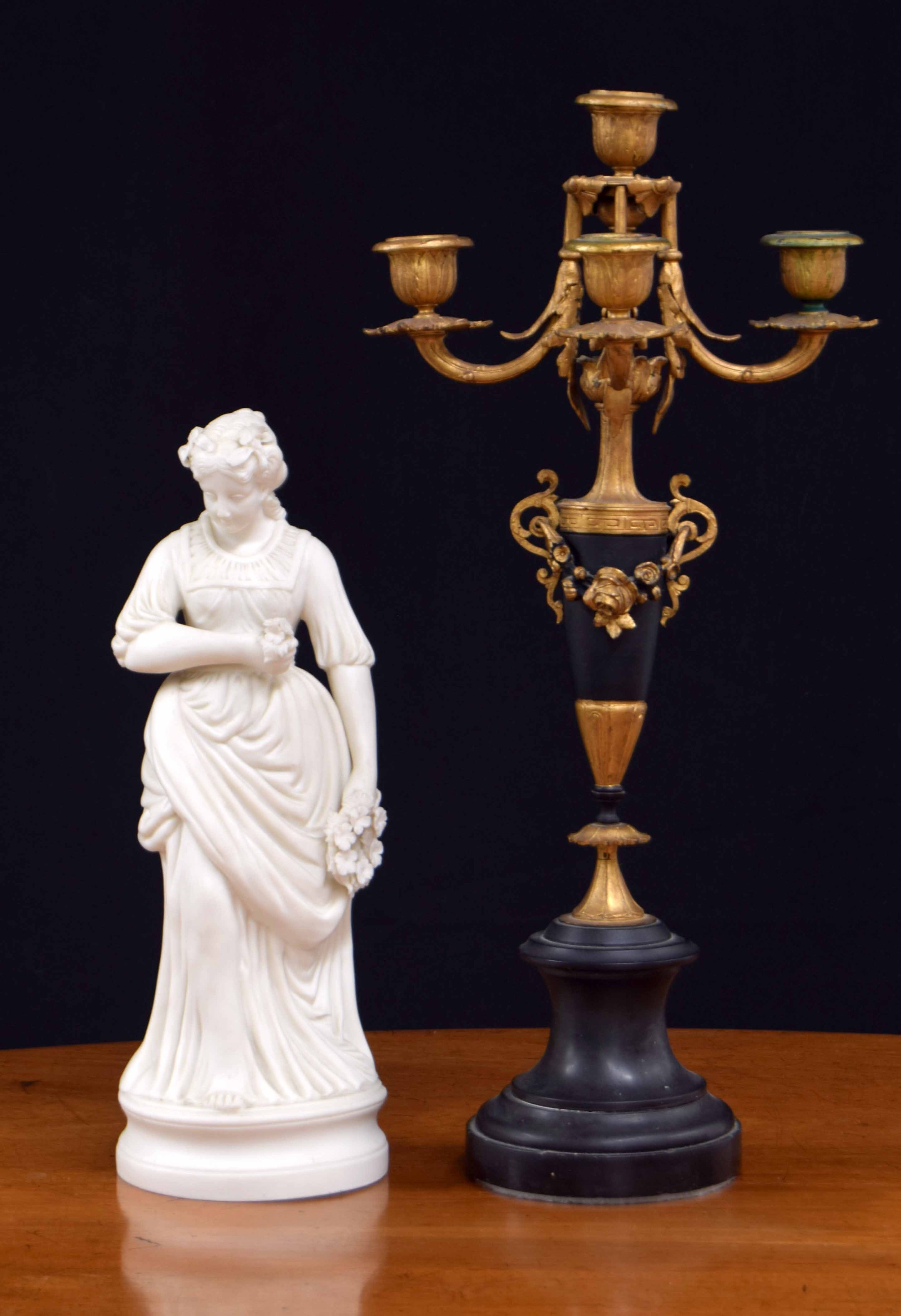 Parian porcelain figure of a lady holding a wreath of flowers, 13" high; together with a French