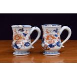 Good pair of Chinese porcelain Imari baluster tankards, decorated with flowers and foliage, with
