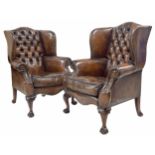 Fine pair of Chesterfield leather wing back armchairs, on shell carved cabriole legs terminating