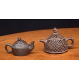 Chinese Yixing clay teapot, the outer reticulated body with fish decoration behind, makers stamp