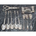 Five Continental silver teaspoons with figural finials, 5" long; together with silver teaspoons