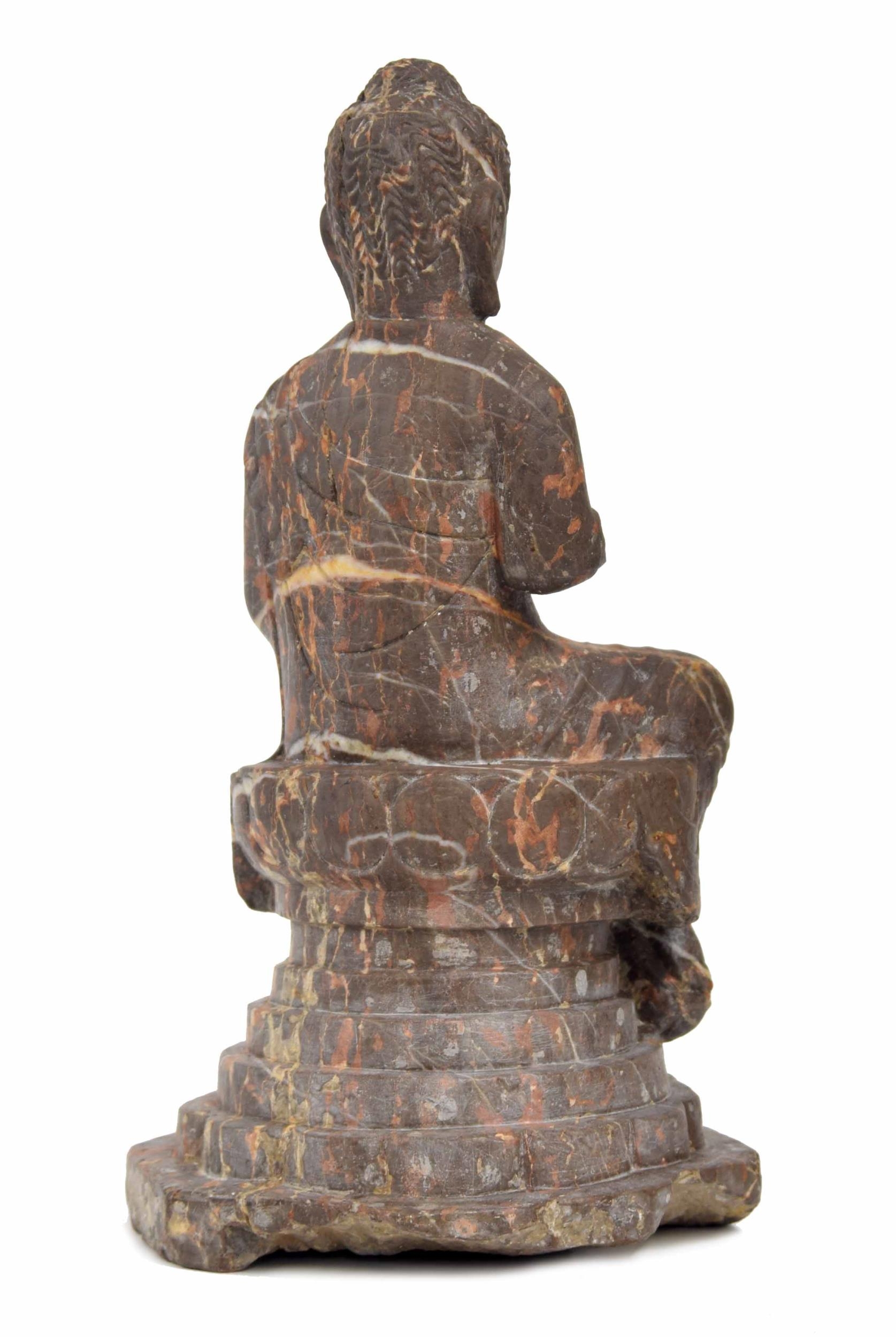 Chinese veined rouge carved marble seated Buddha figure, modelled upon a stepped circular plinth, - Image 2 of 2