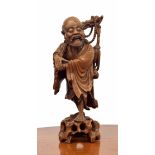 Large Chinese carved rootwood figure of a Sage, with inset bone eyes and teeth, modelled upon a