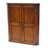 19th century oak corner cupboard, with two panelled doors enclosing a shelved interior, 36" wide,