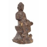 Chinese veined rouge carved marble seated Buddha figure, modelled upon a stepped circular plinth,