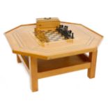 Tony Zemaitis - an octagonal two tier pine coffee table with chess board centre, 33.5" wide, 15"