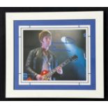 Oasis interest - autographed Noel Gallagher photograph, mounted and framed, 12.75" x 14.75"
