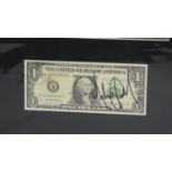 Michael Jackson - autographed dollar bill, mounted below a picture of the artist, 16.5" x 11.5" *