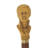 Novelty walking cane, the handle moulded with the bust of Mozart, 38.25" long