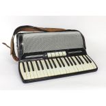 Gaudini piano accordion with one hundred and twenty buttons and five switches, black finish, case