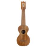 Kumalae ukulele with herringbone banded table and sound hole, bearing the maker's trademark brand to