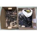 Box of miscellaneous violin parts including chin rests, shoulder rests etc