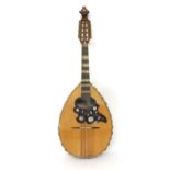 Unusual flatback pear shaped mandolin labelled Paul Beuscher, Instruments de Musique...Paris, with