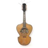 Old mandolin with shield shaped body, spruce banded table and foliate inlaid faux tortoise shell