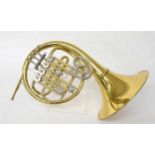 Contemporary Star brass four valve French horn, mouthpiece, within a plush lined fitted case